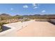 Spacious rooftop deck with mountain views and a stucco wall at 9233 S Krista E Dr, Goodyear, AZ 85338