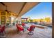Relaxing patio with seating and fire pit near the pool at 9233 S Krista E Dr, Goodyear, AZ 85338
