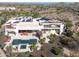 Luxury home with pool, spa, and solar panels; aerial view at 9233 S Krista E Dr, Goodyear, AZ 85338