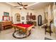 Game room with pool table, wet bar, and access to adjacent areas at 9233 S Krista E Dr, Goodyear, AZ 85338