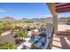 Stunning backyard with a pool, outdoor kitchen, and mountain views at 9233 S Krista E Dr, Goodyear, AZ 85338