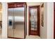 Stainless steel refrigerator and pantry access in a large kitchen at 9233 S Krista E Dr, Goodyear, AZ 85338