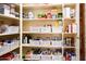 Well-organized pantry with ample shelving and storage containers at 9233 S Krista E Dr, Goodyear, AZ 85338