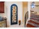 Wine cellar with decorative door and staircase access at 9233 S Krista E Dr, Goodyear, AZ 85338