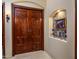 Ornate double doors with detailed carvings at 9233 S Krista E Dr, Goodyear, AZ 85338