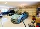 Bright garage with overhead lighting, and space for multiple cars at 9233 S Krista E Dr, Goodyear, AZ 85338