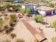 Aerial of a home with horseshoe pit and desert landscaping at 9233 S Krista E Dr, Goodyear, AZ 85338