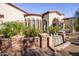 Water feature and landscaping next to a luxury home at 9233 S Krista E Dr, Goodyear, AZ 85338
