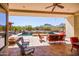 Spacious backyard with a pool, spa, and mountain views at 9233 S Krista E Dr, Goodyear, AZ 85338