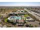 Community pool with a large sundeck and desert landscaping at 9233 S Krista E Dr, Goodyear, AZ 85338