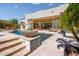 Stunning pool and spa with spacious patio and seating; resort-style backyard at 9233 S Krista E Dr, Goodyear, AZ 85338