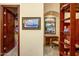 Bedroom with a desk, closet, and artwork at 9233 S Krista E Dr, Goodyear, AZ 85338