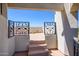 Access to rooftop deck with ornate iron railings at 9233 S Krista E Dr, Goodyear, AZ 85338