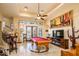Game room featuring a pool table, large TV, and a wet bar at 9233 S Krista E Dr, Goodyear, AZ 85338