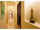 Elegant hallway with arched entryways and decorative accents at 9233 S Krista E Dr, Goodyear, AZ 85338