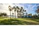 Lakefront pool area with palm trees and lighthouse water slide at 9233 S Krista E Dr, Goodyear, AZ 85338