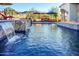 Stunning pool with waterfall, fire pit, and lounge chairs at 9233 S Krista E Dr, Goodyear, AZ 85338