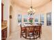 Breakfast nook with a table and chairs, offering a view of the pool at 9233 S Krista E Dr, Goodyear, AZ 85338