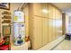 Additional garage storage with built-in cabinets and shelving at 9233 S Krista E Dr, Goodyear, AZ 85338