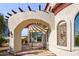 Outdoor patio with hanging bench under archway at 9233 S Krista E Dr, Goodyear, AZ 85338