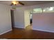 Living room with hardwood floors and view into kitchen at 4327 E San Gabriel Ave, Phoenix, AZ 85044