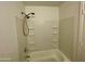 Clean bathroom with shower and storage shelves at 424 W Brown Rd # 143, Mesa, AZ 85201