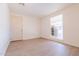 Spacious bedroom with wood-look floors and a window at 7322 N 61St Ave, Glendale, AZ 85301