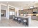 Modern kitchen with expansive island, stainless steel appliances, and ample cabinetry at 25564 N 119Th St, Scottsdale, AZ 85255