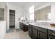 Elegant bathroom with double vanity and walk-in shower at 20948 E Arrowhead Trl, Queen Creek, AZ 85142