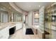 Elegant bathroom with a large vanity, soaking tub and glass-block shower at 6545 N 29Th St, Phoenix, AZ 85016