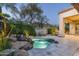 Private kidney shaped pool with a waterfall feature at 6545 N 29Th St, Phoenix, AZ 85016