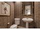 Powder room with pedestal sink and decorative wallpaper at 6545 N 29Th St, Phoenix, AZ 85016