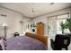 Bright bedroom with a cozy sitting area and access to a private balcony at 6545 N 29Th St, Phoenix, AZ 85016