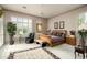 Spacious main bedroom with large windows, hardwood floors and an ensuite bathroom at 6545 N 29Th St, Phoenix, AZ 85016