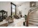 Open living area with dining space and a curved staircase at 6545 N 29Th St, Phoenix, AZ 85016