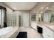 Luxury bathroom with a large soaking tub, walk-in shower, and double vanity at 6545 N 29Th St, Phoenix, AZ 85016