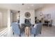Bright living room with fireplace and dining area. Features hardwood floors and modern decor at 7344 E Keim Dr, Scottsdale, AZ 85250