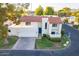 Attractive two-story home with terracotta tile roof and a two-car garage at 7344 E Keim Dr, Scottsdale, AZ 85250