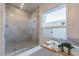 Spa-like bathroom with a walk-in shower and marble tile at 7344 E Keim Dr, Scottsdale, AZ 85250