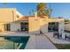 Inviting backyard oasis with a sparkling pool, patio furniture, and lush landscaping at 7344 E Keim Dr, Scottsdale, AZ 85250