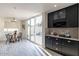 Eat-in kitchen with granite counters, stainless steel appliances, and access to backyard at 7344 E Keim Dr, Scottsdale, AZ 85250