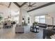 Open living room with high ceilings, exposed beams, and modern furniture at 7344 E Keim Dr, Scottsdale, AZ 85250