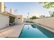 Large, inviting pool with a spacious deck for sunbathing at 7344 E Keim Dr, Scottsdale, AZ 85250