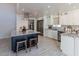 Modern kitchen with large island, stainless steel appliances, and granite countertops at 7344 E Keim Dr, Scottsdale, AZ 85250