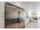 Modern kitchen with stainless steel refrigerator and white cabinets at 7344 E Keim Dr, Scottsdale, AZ 85250