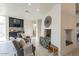Cozy bar area with dark cabinetry and a stone fireplace at 7344 E Keim Dr, Scottsdale, AZ 85250