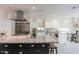 Spacious kitchen with large island, stainless steel appliances, and granite countertops at 7344 E Keim Dr, Scottsdale, AZ 85250