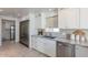 Modern kitchen with white shaker cabinets, granite countertops, and stainless steel appliances at 7344 E Keim Dr, Scottsdale, AZ 85250