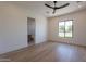 Spacious bedroom with hardwood floors and en-suite bathroom at 4723 E Desert Park Pl, Paradise Valley, AZ 85253