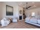 Main bedroom with fireplace and sitting area, hardwood floors at 4723 E Desert Park Pl, Paradise Valley, AZ 85253